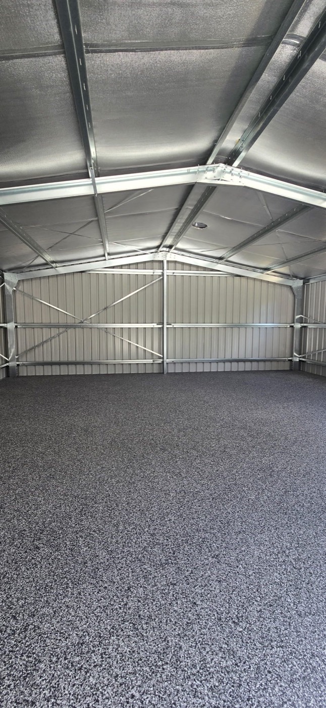 Charcoal flake epoxy floor in a large residential shed